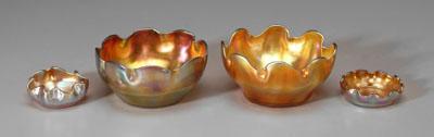 Appraisal: Four Tiffany favrile bowls all with scalloped rims iridescent gold