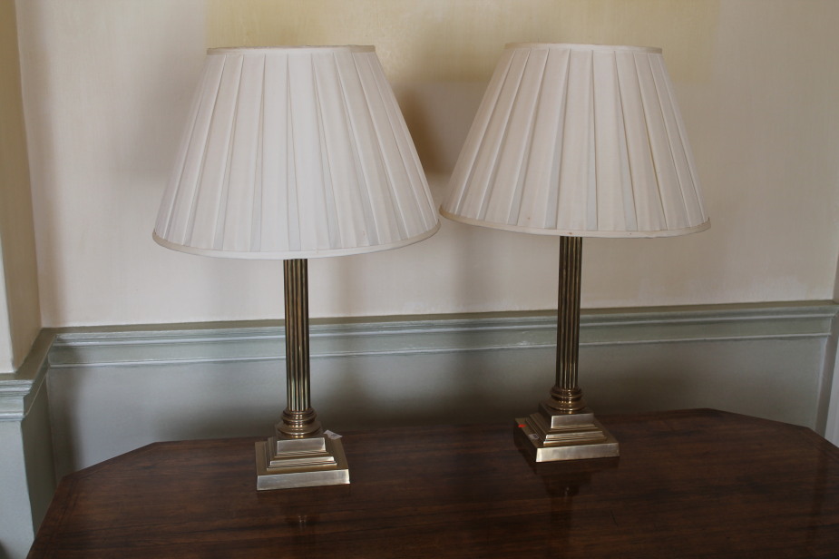 Appraisal: A pair of brass table lamps of Corinthian columnar form