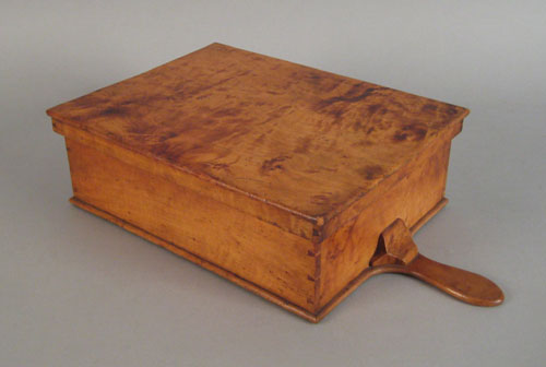 Appraisal: Figured maple storage box ca with a side handle and