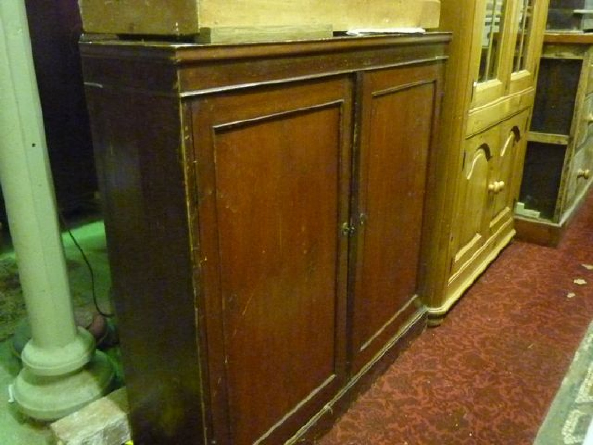 Appraisal: A th century stained pine side cupboard enclosed by a