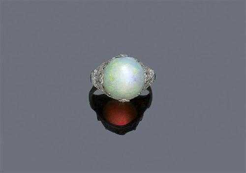 Appraisal: WHITE OPAL AND DIAMOND RING ca Platinum Decorative geometrically open-worked