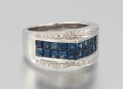 Appraisal: A Ladies' Invisibly Set Sapphire and Diamond Ring k white