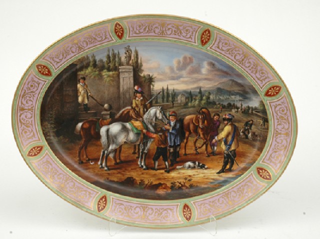 Appraisal: A CONTINENTAL PORCELAIN PLATTER Oval painted with a scene depicting