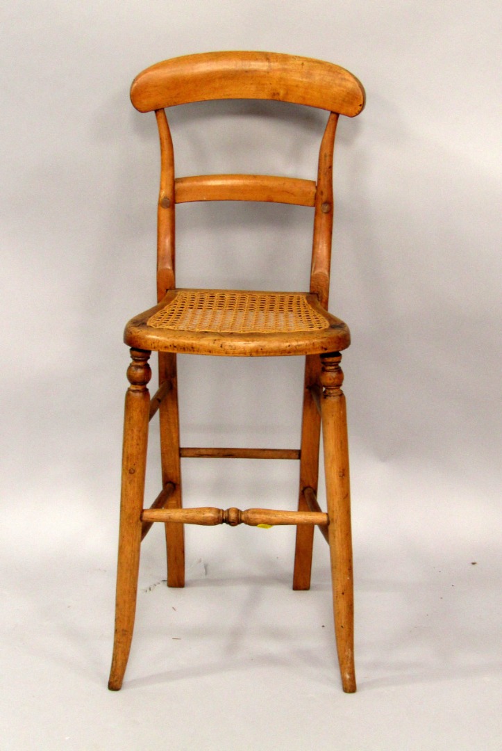 Appraisal: A Victorian child's oak correction chair with cane seat raised