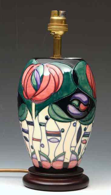 Appraisal: A MOORCROFT POTTERY TABLE LAMP decorated with stylised flowers in