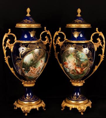 Appraisal: A pair of large decorative porcelain urns with gilt metal