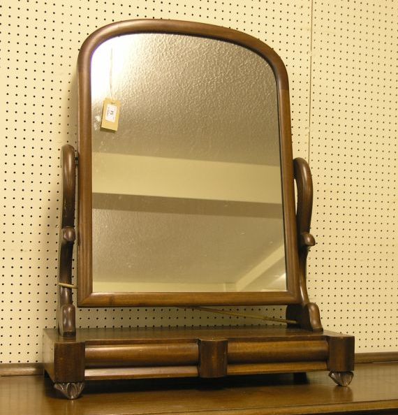 Appraisal: A Victorian mahogany toilet mirror domed plate above two drawer