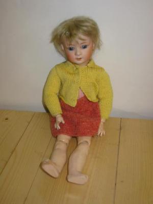 Appraisal: A Heubach bisque head character doll with fixed blue eyes