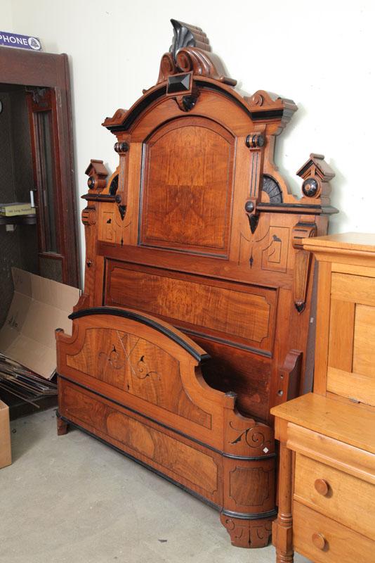 Appraisal: VICTORIAN BED Large walnut and flame grain veneered bed with