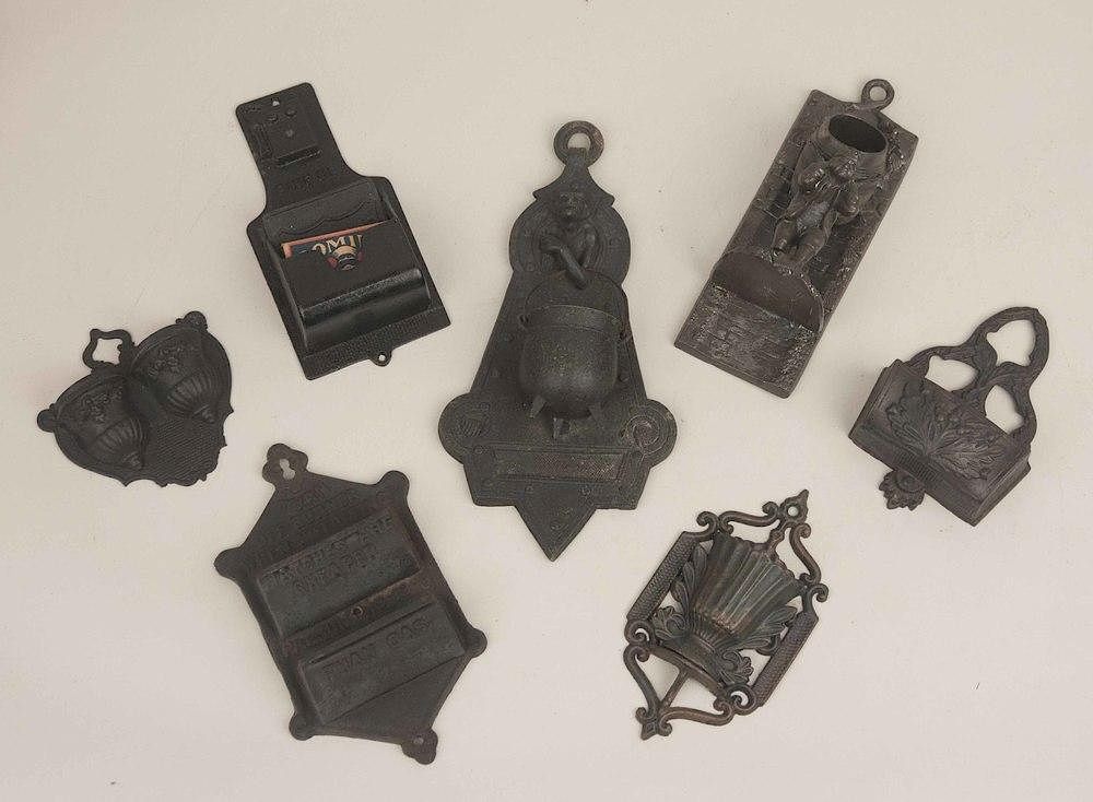 Appraisal: Assorted Cast Iron Match Holders Seven assorted cast iron match