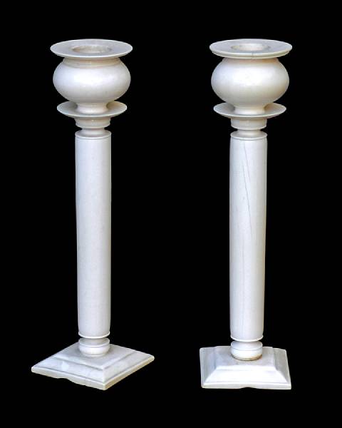 Appraisal: A pair of Anglo-Indian ivory columnar candlesticks th century Each