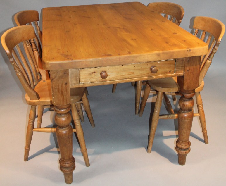 Appraisal: A stripped and lightly polished pine kitchen table the oblong