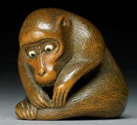 Appraisal: ANTIQUE WOOD NETSUKE Charming and antique carved wood netsuke of