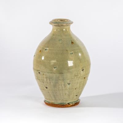 Appraisal: Mike Dodd British born a celadon glaze bottle vase with