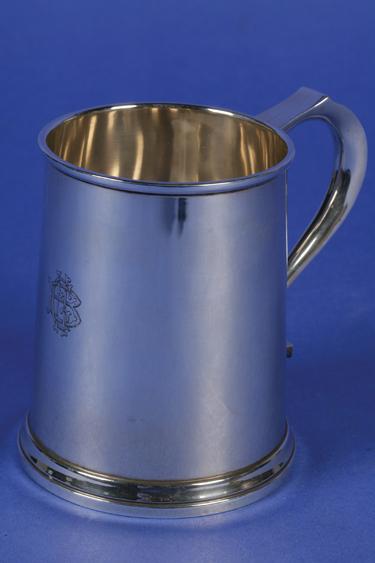 Appraisal: A PINT MUG of circular form with a scroll handle