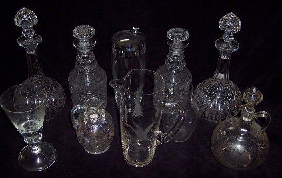 Appraisal: A collection of four decanters and stoppers an engraved glass