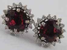 Appraisal: A white metal tests carat gold pair of garnet and