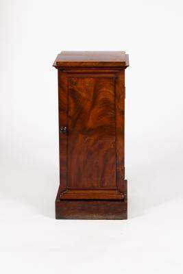 Appraisal: A late Victorian mahogany pedestal cupboard with stepped top and