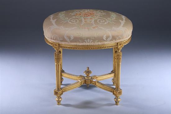 Appraisal: LOUIS XVI STYLE CARVED AND GILT-WOOD UPHOLSTERED OVAL STOOL late