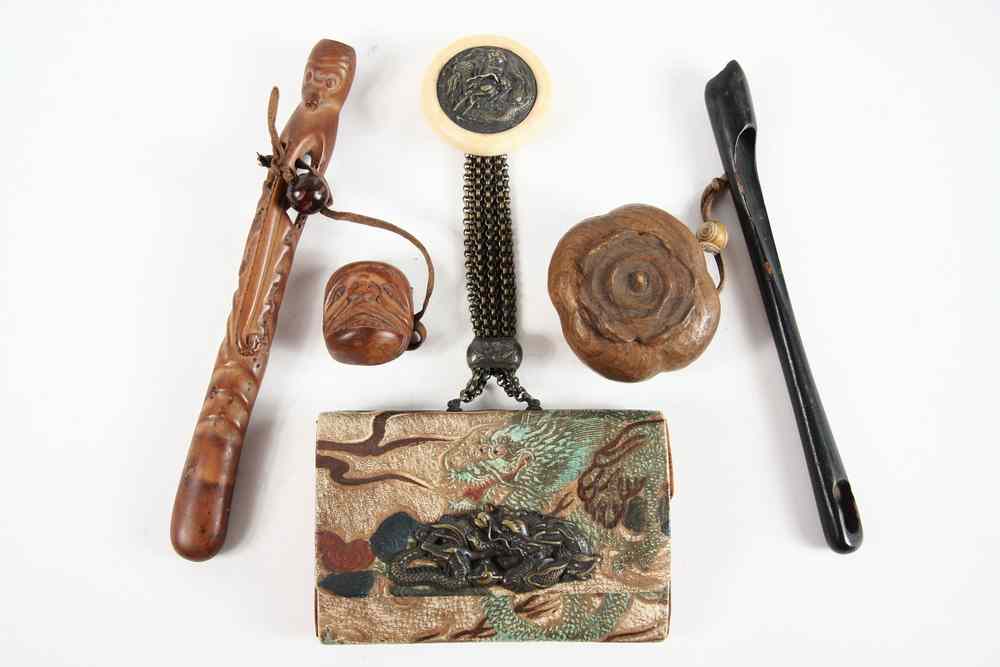 Appraisal: JAPANESE SMOKING ACCESSORIES - Leather Tobacco Pouch decorated with a