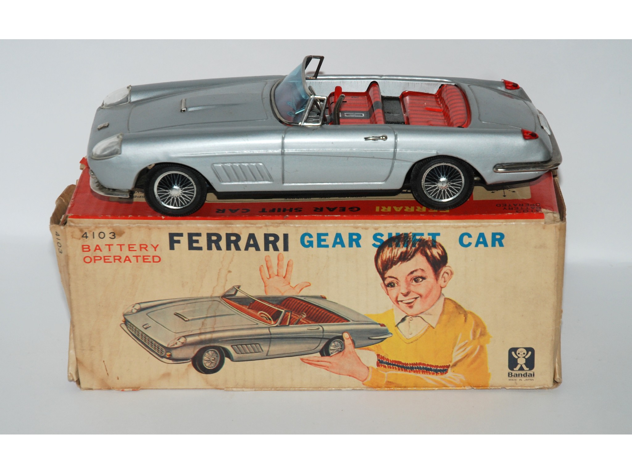 Appraisal: Three boxes of various toys including Bandai's battery operated Ferrari