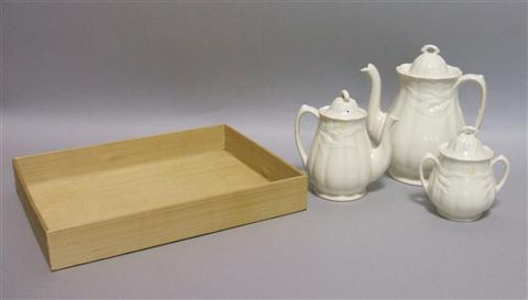 Appraisal: THREE PIECE IRONSTONE TEA SET Cream glazed with a pot