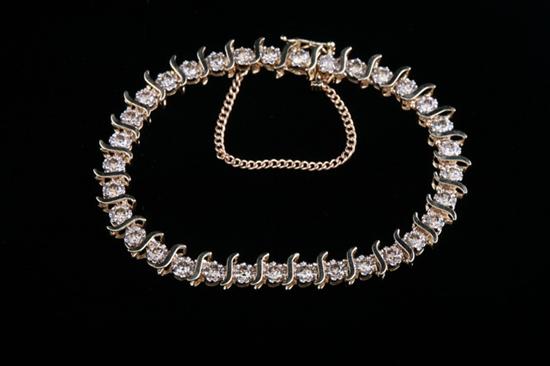 Appraisal: K YELLOW GOLD AND DIAMOND BRACELET Thirty-three mm round full-cut