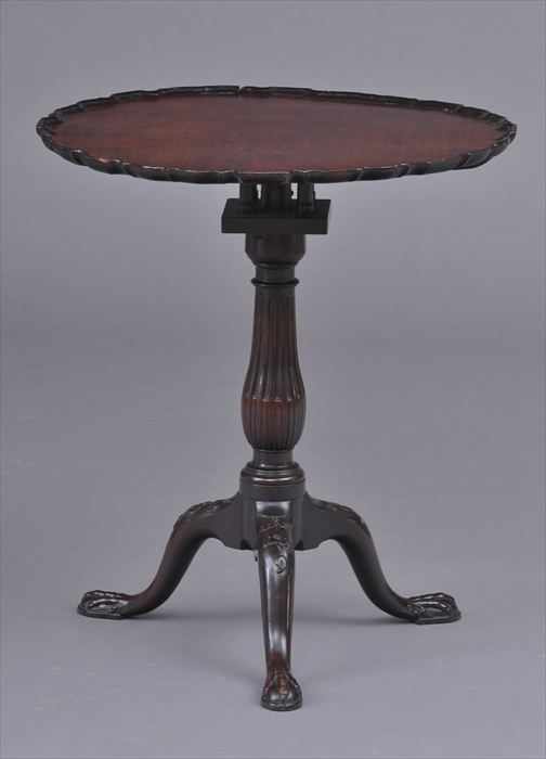 Appraisal: GEORGE III CARVED MAHOGANY TRIPOD TEA TABLE POSSIBLY IRISH The