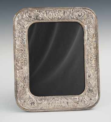 Appraisal: A Large Silver and Mahogany Picture Frame Rectangular shape with