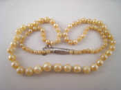 Appraisal: A graduated cultured pearl necklace with an carat white gold