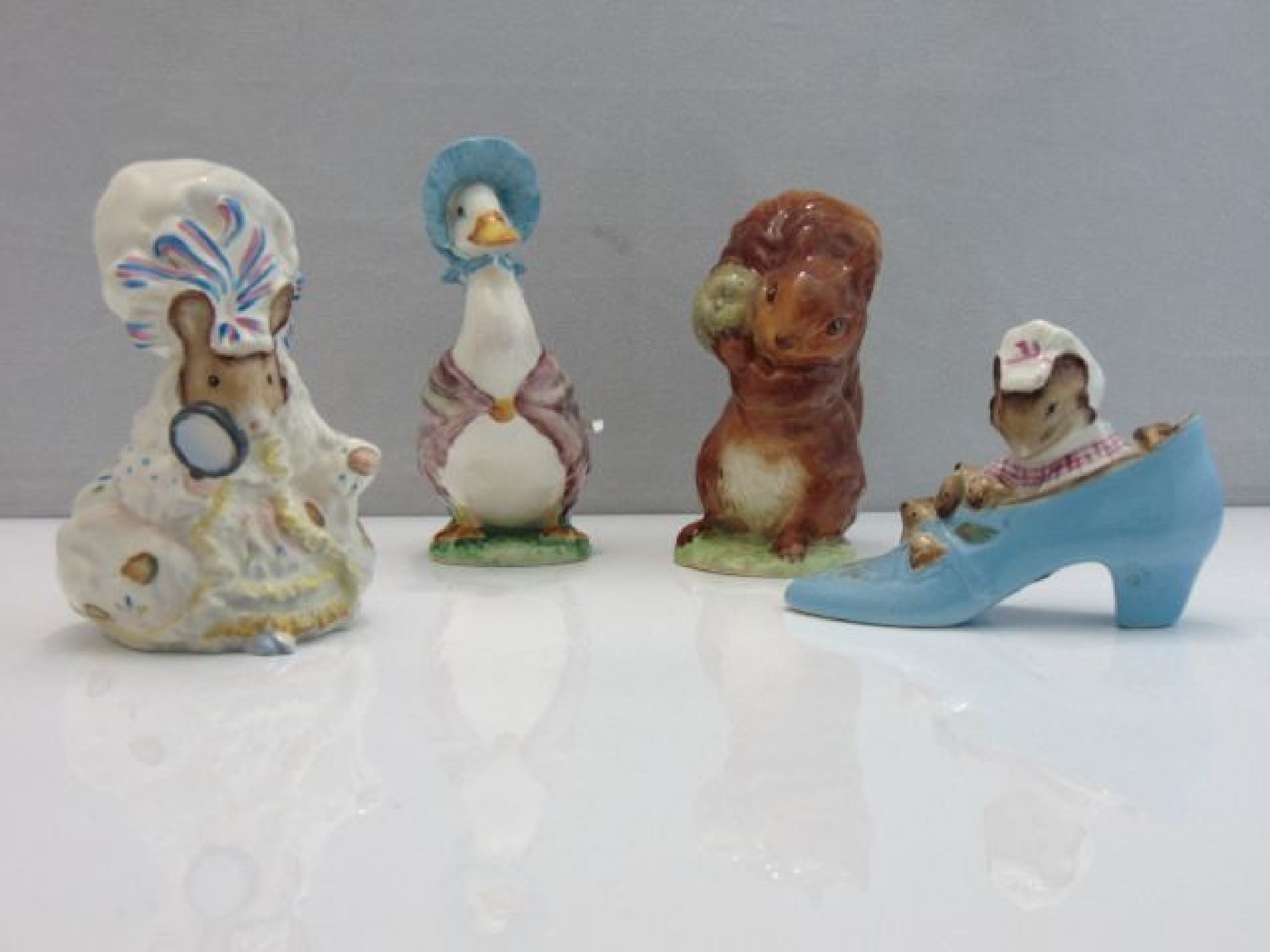 Appraisal: A collection of four Beswick Beatrix Potter figures - Squirrel