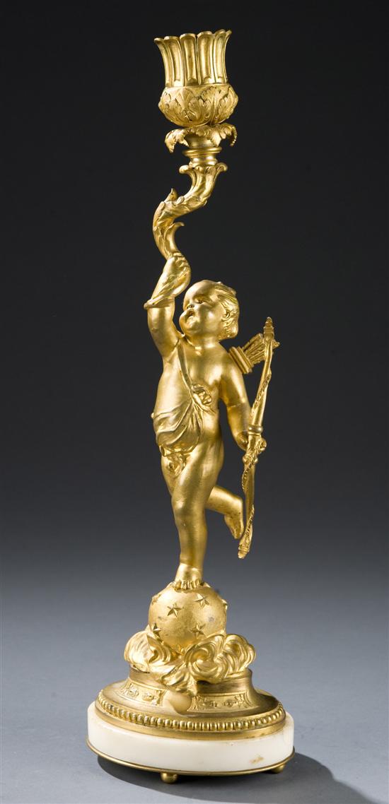 Appraisal: Fire Gilt Figural Candlestick th century Cupid stands atop a