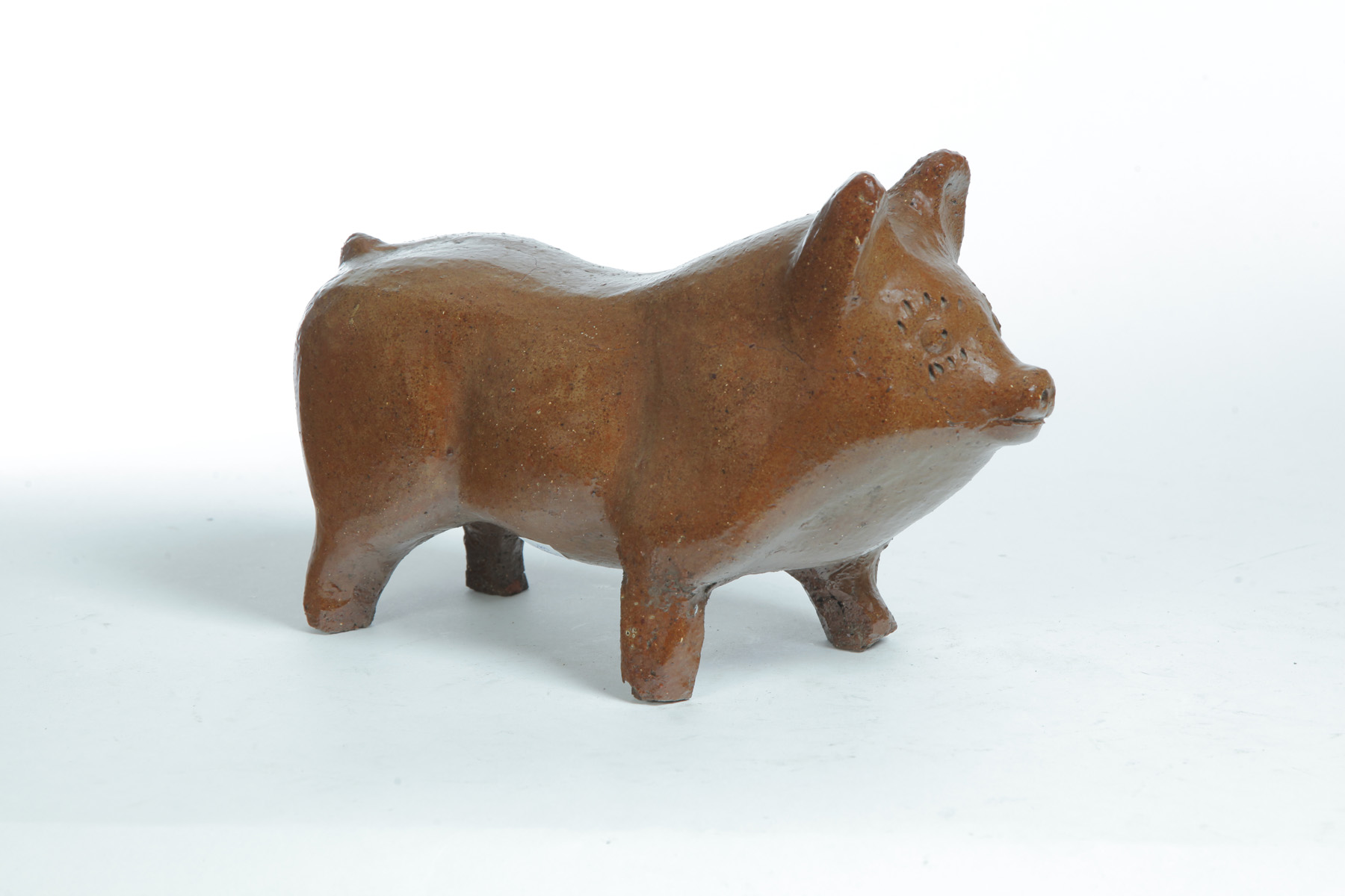 Appraisal: OHIO SEWERTILE PIG First half- th century Standing pig with