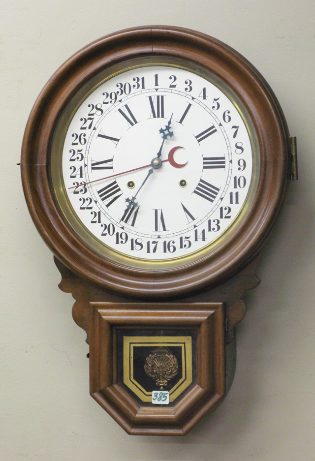 Appraisal: AN AMERICAN CALENDAR WALL CLOCK The E Ingraham Clock Co