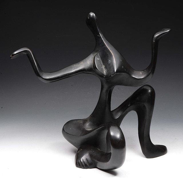 Appraisal: AN ABSTRACT BRONZE SCULPTURE of seated figure form with outstretched