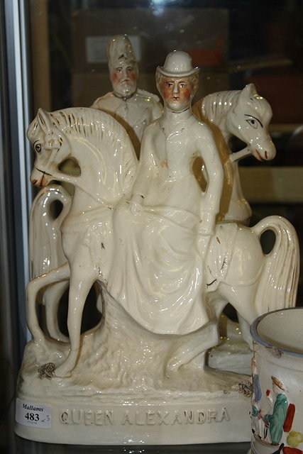 Appraisal: A PAIR OF STAFFORDSHIRE EQUESTRIAN FIGURES Queen Alexandra and King