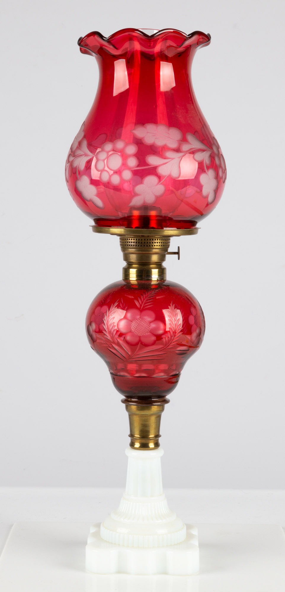 Appraisal: CRANBERRY OVERLAY OIL LAMP circa Cranberry overlay cut to clear