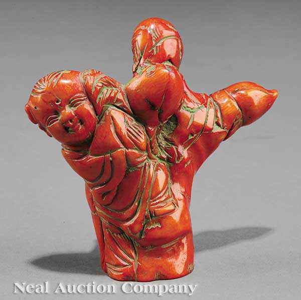 Appraisal: A Chinese Coral Figure of a Young Boy carved in