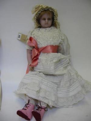 Appraisal: A poured wax shoulder head girl doll late th century