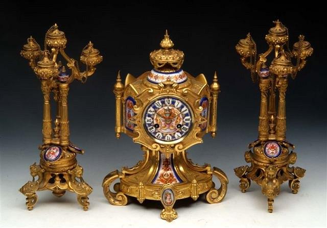 Appraisal: A FRENCH ORMOLU AND PORCELAIN MOUNTED GARNITURE DU CHEMIN E