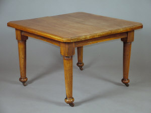 Appraisal: A Victorian walnut extending dining table the moulded top upon