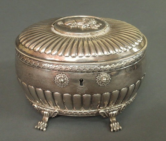 Appraisal: French silver tea caddy oval form repouss silver the top