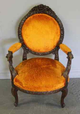 Appraisal: Finely Carved and Upholstered Arm Chair With rams' heads for