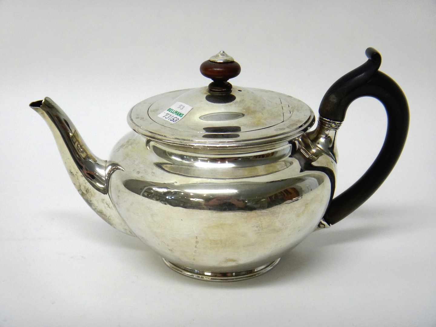 Appraisal: A George III silver teapot of plain circular form with