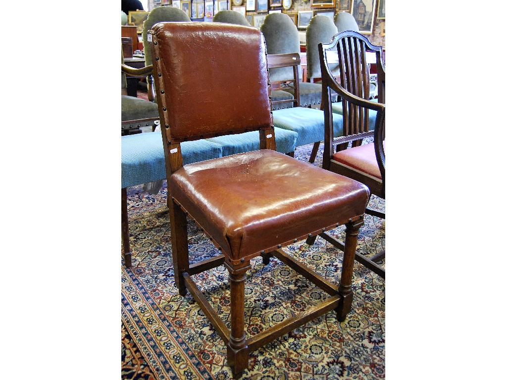 Appraisal: A Victorian oak and brown leather upholstered hall chair raised