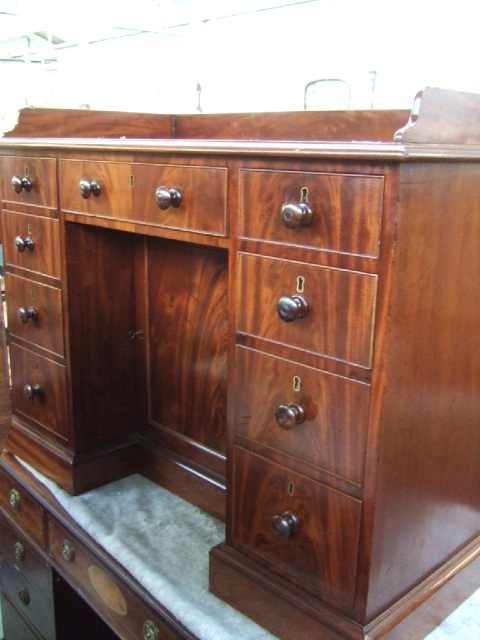 Appraisal: A Victorian mahogany kneehole dressing table the galleried back over