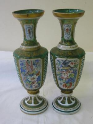 Appraisal: A PAIR OF VICTORIAN CASED GLASS VASES of baluster form