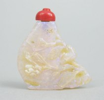 Appraisal: A Carved Opal Snuff Bottle A snuff bottle carved out