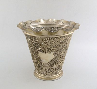 Appraisal: A late Victorian embossed jardiniere pierced and tapering with a