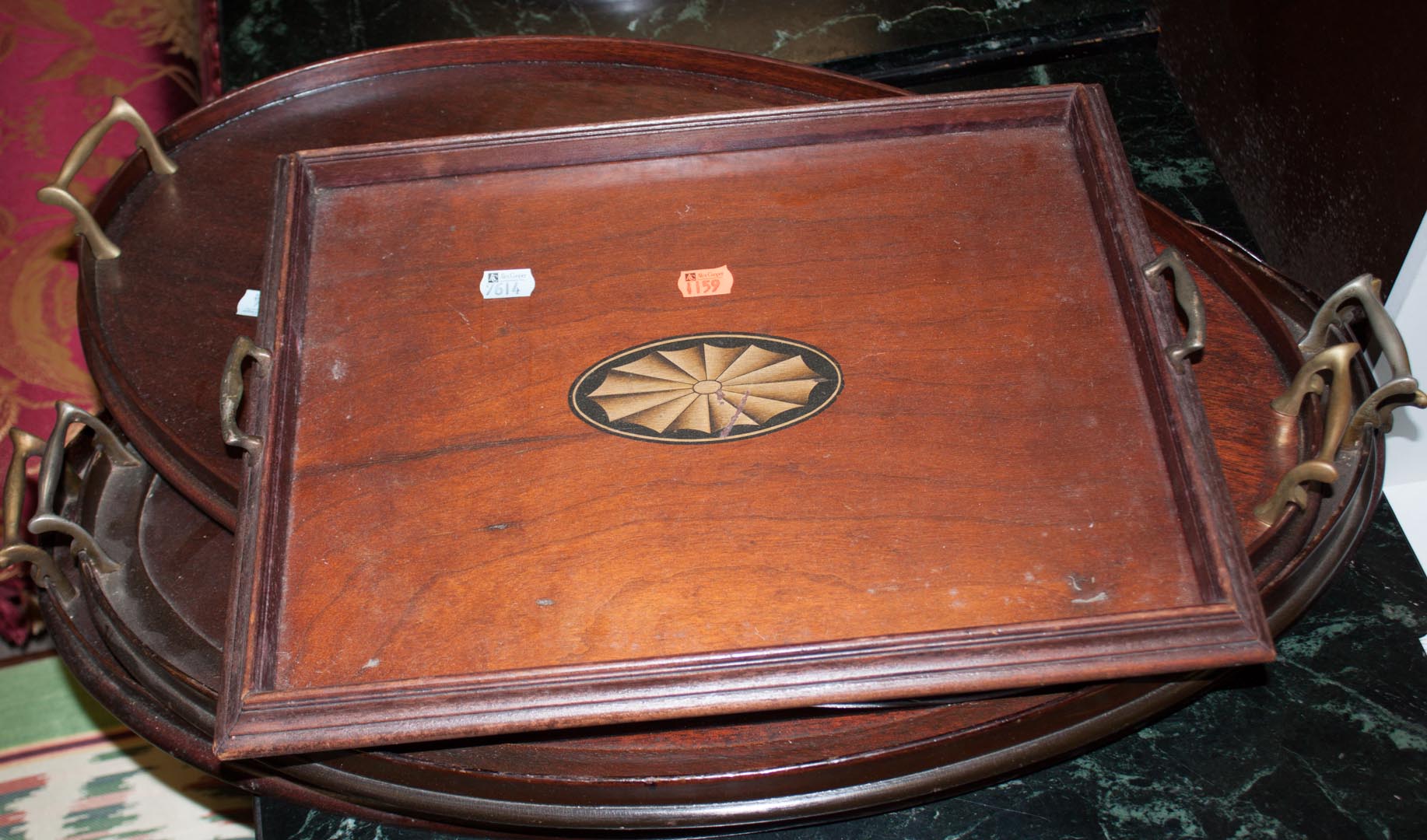 Appraisal: Four Edwardian inlaid mahogany trays Condition All have scratches and